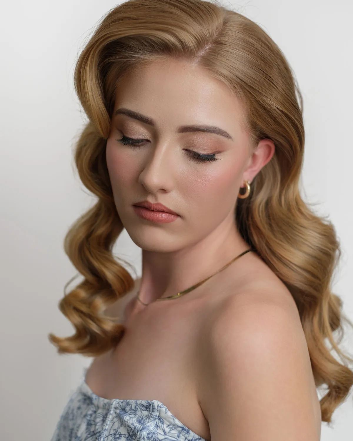 A Lustique bride on her wedding morning — softly lit, hair styled, looking quietly radiant